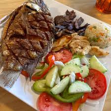 Luna Del Mar signature dishes Mojarra Frita Super (Whole Fried Fish With Sauce)Flour Quesadilla With MeatTacos De Camaron (Trio)Fajitas Mix